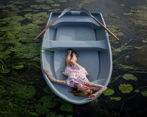 Woman relaxing in a blooming garden